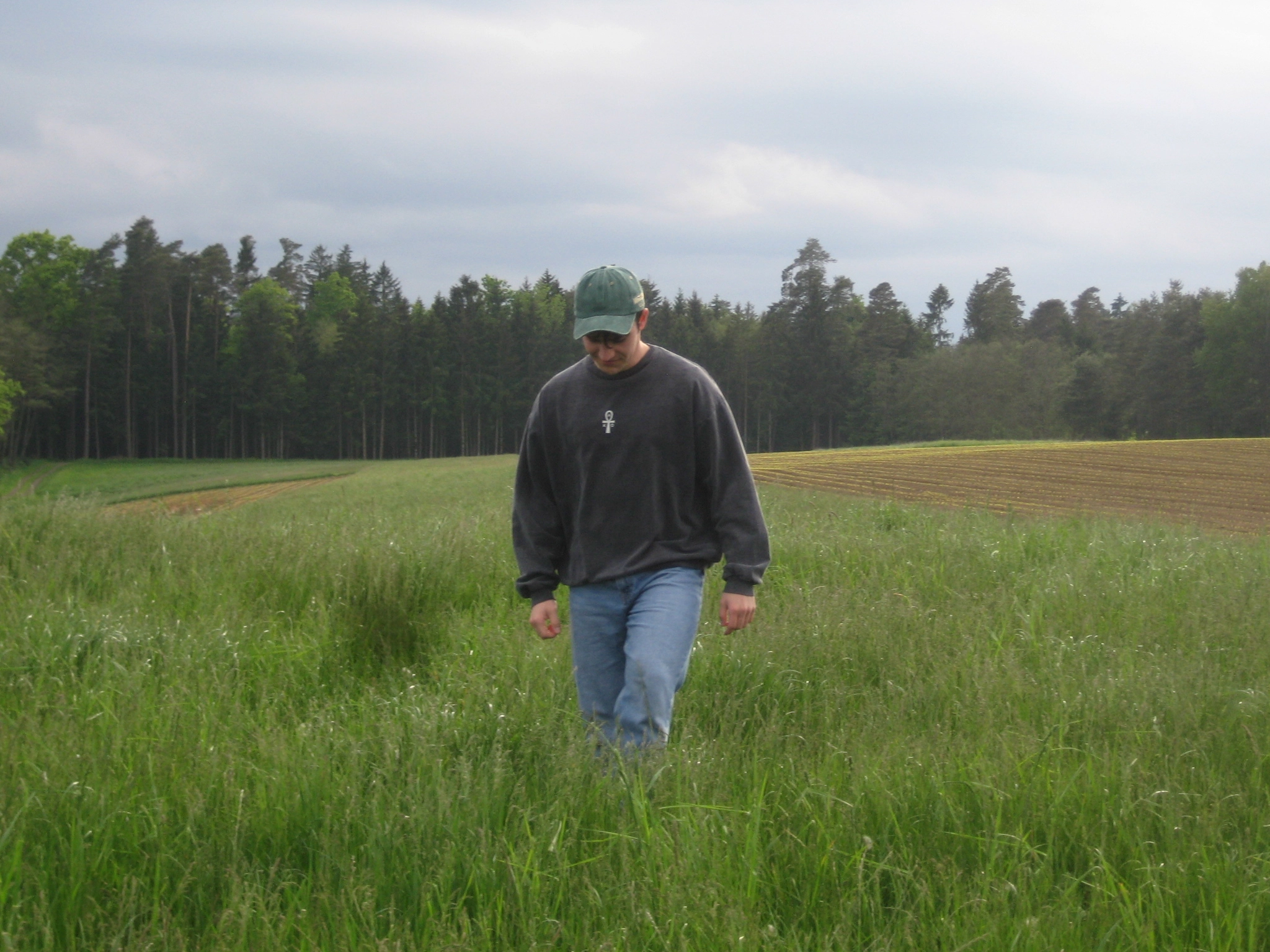 man walking in a field