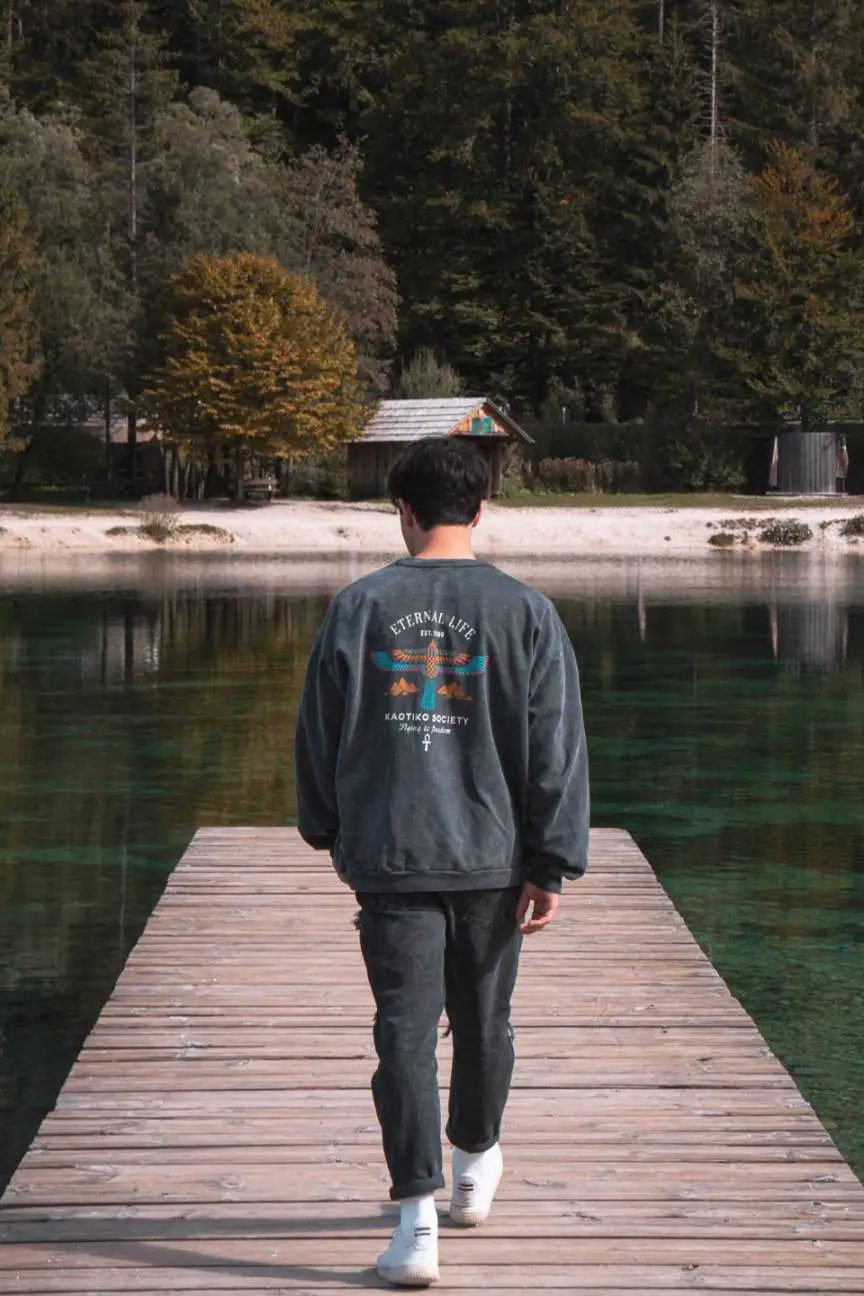 man walking on a pier